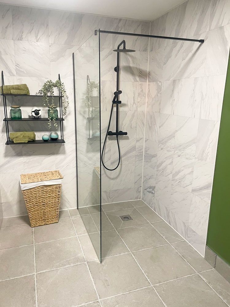 bathroom on ground floor with bath and 2 showers